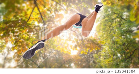 Directly below shot of sportsperson long jumping 135041504