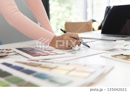 Creative web designer planning UI application and developing digital template 135042021