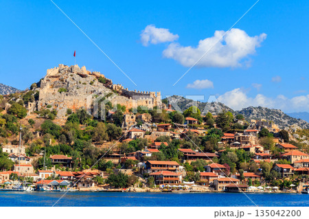 View of ancient Lycian town Simena with fortress on a mount on the coast of the Mediterranean sea in Antalya Province, Turkey View of ancient Lycian town Simena with fortress on a mount on the coast of the Mediterranean sea in Antalya Province, Turkey 135042200