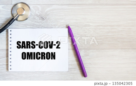 Omicron SARS-CoV-2 .There is an Omicron SARS-CoV-2 entry on a white background on the notebook.  135042305