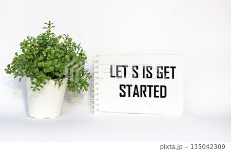 Let's get started, text on a notepad and a white background. business concept Let's get started, text on a notepad and a white background. business concept 135042309