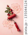 Minimal floral still life with roses and decorative paint roller design 135044124