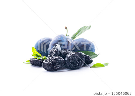 Tasty ripe plums with organic dried prunes background Tasty ripe plums with organic dried prunes background 135046063