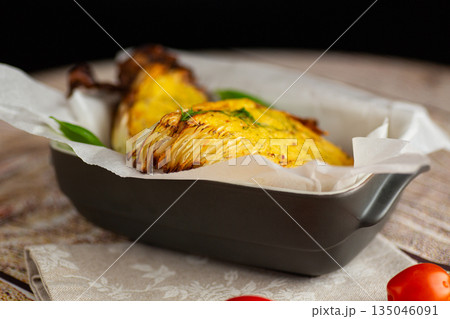 Hot baked cabbage served in tray with fresh herbs Hot baked cabbage served in tray with fresh herbs 135046091