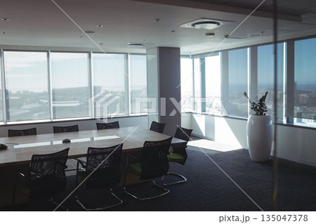 Empty chairs and table in boardroom 135047378