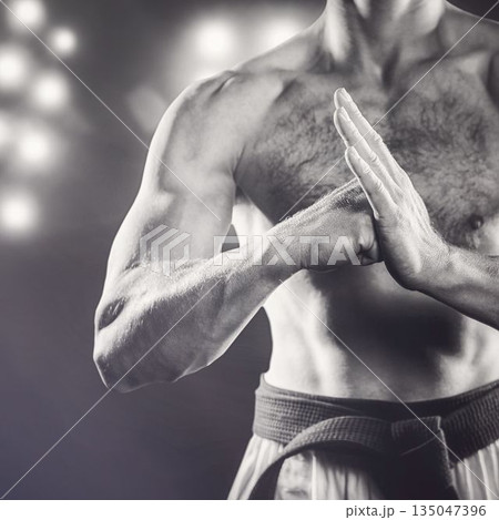 Midsection of shirtless martial artist 135047396