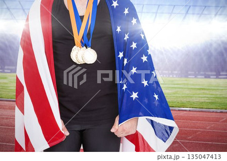 Midsection of athlete with American Flag at stadium 135047413