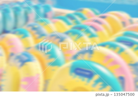 Blurred photo of inflatable water slide rings, summer abstract background or wallpaper. 135047500