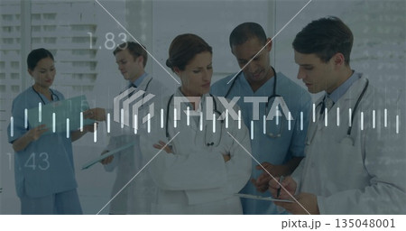 Staff in uniforms reviewing patient charts with tablet, clipboard and stethoscopes in hospital hall Staff in uniforms reviewing patient charts with tablet, clipboard and stethoscopes in hospital hall 135048001