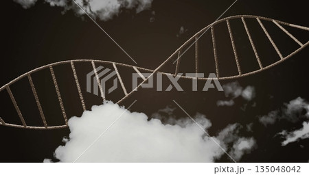 Twisting rope-like double helix structure stretching across dark sky, with grey-white clouds 135048042