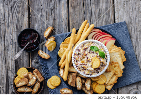 cranberry apricot cheese spread in a bowl 135049956