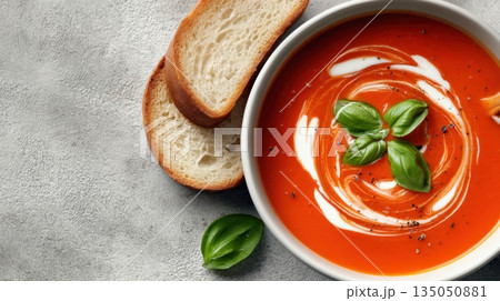 Tomato soup with basil and bread 135050881