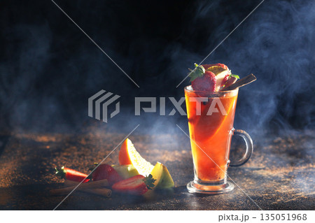 Healthy tea for winter. Hot orange tea with cinnamon. A warming drink. Vitamin C. Healthy tea for winter. Hot orange tea with cinnamon. A warming drink. Vitamin C. 135051968