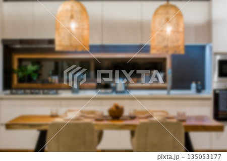 A private dining room atmosphere, elegant tableware, and warm lighting; blurred background. 135053177