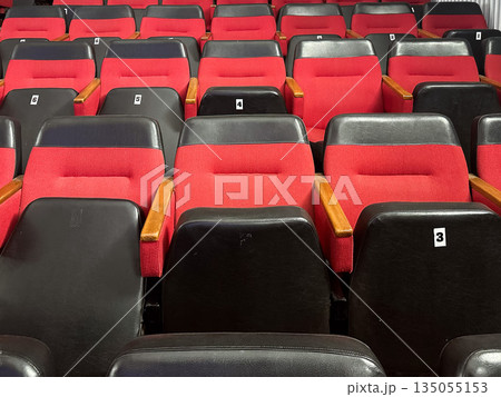Empty red and black theater seats 135055153