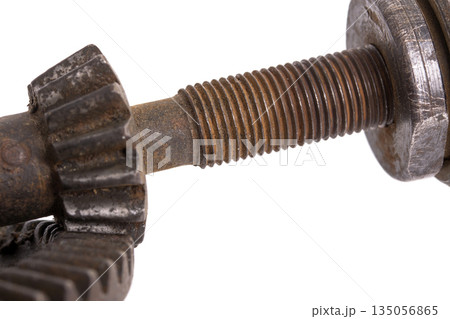 Detail of an old machine gear on a white background Detail of an old machine gear on a white background 135056865