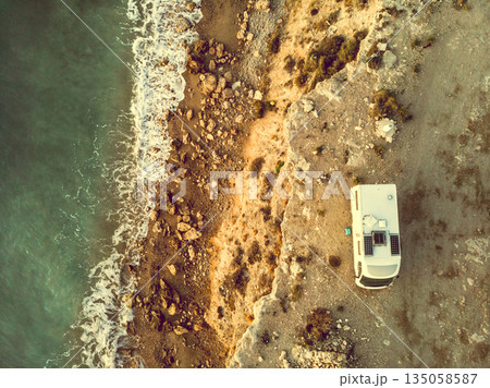 Rv caravan on spanish rocky coast. Aerial view Rv caravan on spanish rocky coast. Aerial view 135058587