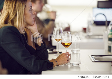 Female Sommelier on Beer Tasting Courses. Woman Participant is Training Dedicated to Making Beer and Brewing. 135059264