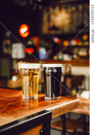 Lager and Stout Beer Served at Cozy Bar Table Lager and Stout Beer Served at Cozy Bar Table 135059513