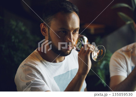 Professional sommelier smell unknown whiskey during blind tasting. Sommelier exam to study different wine and whiskey. 135059530