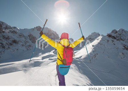 Person in Yellow Jacket and Purple Pants Skiing Person in Yellow Jacket and Purple Pants Skiing 135059654