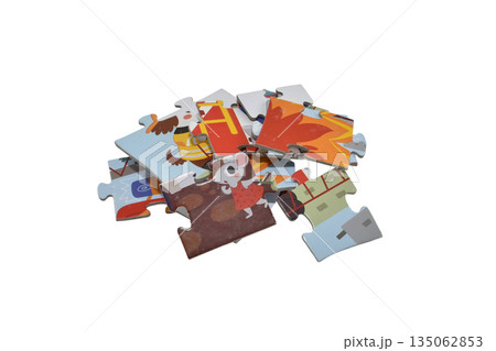 A small pile of cardboard puzzles. A small pile of cardboard puzzles. 135062853
