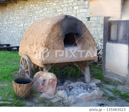 Old clay oven in the yard Old clay oven in the yard 135063023