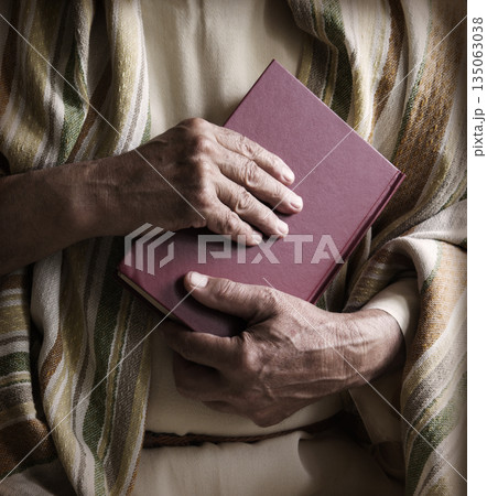 Old man holding a book Old man holding a book 135063038