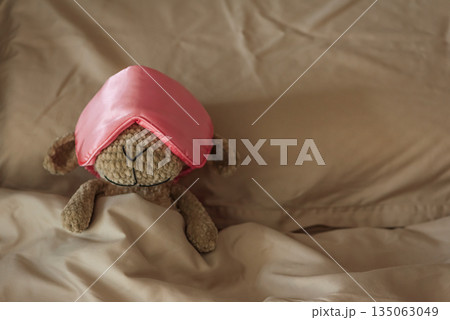 Knitted Sheep Toy Sleeping with Satin Mask on Cozy Bed 135063049