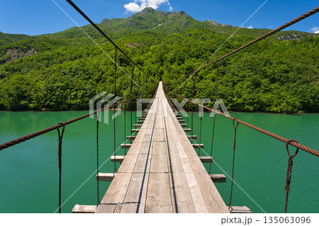 Shkopet lake with a mysterious bridge over the river 135063096