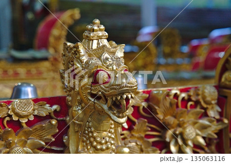 Dragon figure in a Balinese temple in red and gold colours Dragon figure in a Balinese temple in red and gold colours 135063116