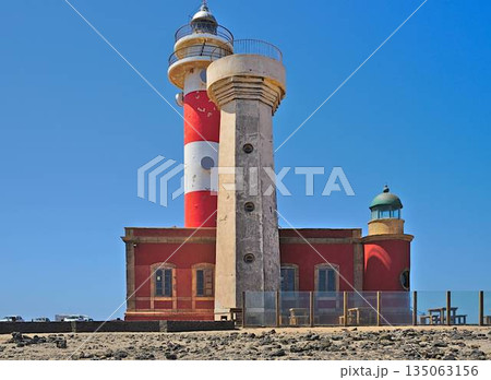 Toston lighthouse in El Cotillo at Fuerteventura Canary Islands Toston lighthouse in El Cotillo at Fuerteventura Canary Islands 135063156