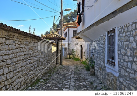 Cobbled street in Berat city on a sunny day Cobbled street in Berat city on a sunny day 135063247