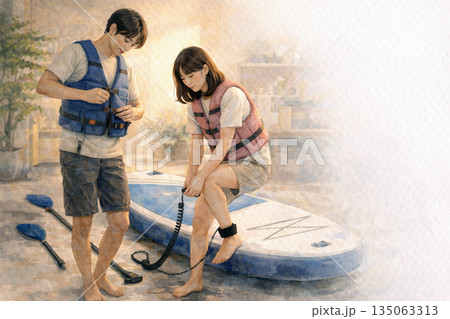 夜の室内でSUPの準備をする日本人カップル 135063313