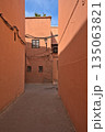 Red colored houses in Marrakesh and an alley 135063821
