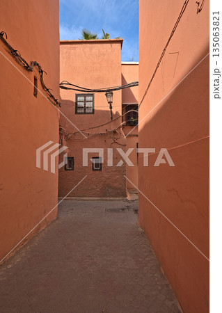 Red colored houses in Marrakesh and an alley Red colored houses in Marrakesh and an alley 135063821