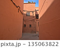 Red colored houses in Marrakesh and an alley 135063822