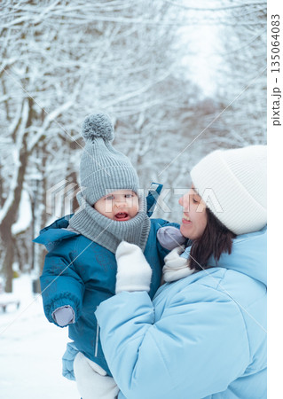 Mother and Child in Winter Wonderland 135064083