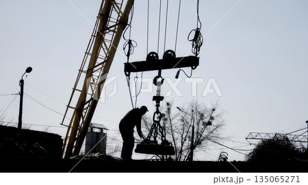 Technician Engineer Adjusting Magnetic Gripper Of Gantry Crane Technician Engineer Adjusting Magnetic Gripper Of Gantry Crane 135065271