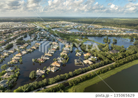 Hurricane Debby tropical rainstorm flooded residential homes in suburban community in Sarasota, Florida. Aftermath of natural disaster 135065629
