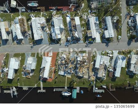 Florida Southwest region after hurricane season. Collapsed and damaged mobile homes in rural residential area. Consequences of severe natural disaster Florida Southwest region after hurricane season. Collapsed and damaged mobile homes in rural residential area. Consequences of severe natural disaster 135065699