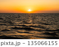 A breathtaking golden sunset illuminates the serene Black Sea horizon 135066155