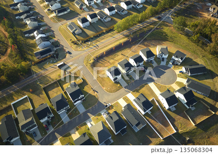 Cul de sac at neighbourhood road dead end with densely built homes in South Carolina residential living area. Real estate development of family houses and infrastructure in american suburbs 135068304