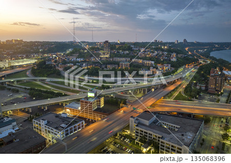 Cincinnati, Ohio transportation infrastructure. View from above of American big freeway intersection at night with fast moving cars 135068396