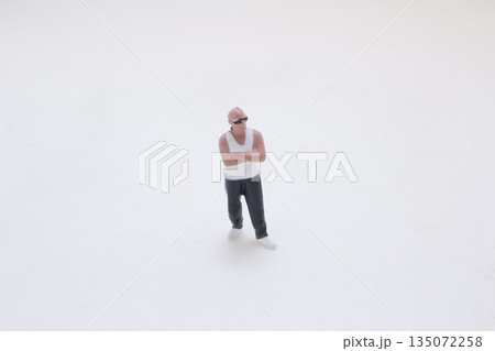 Miniature Man Figurine in White T Shirt and Black Shorts Miniature Man Figurine in White T Shirt and Black Shorts 135072258