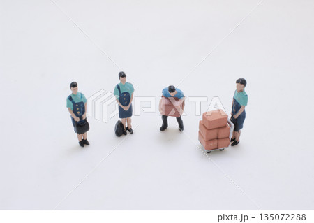 A Miniature Construction Team Works With Bricks A Miniature Construction Team Works With Bricks 135072288
