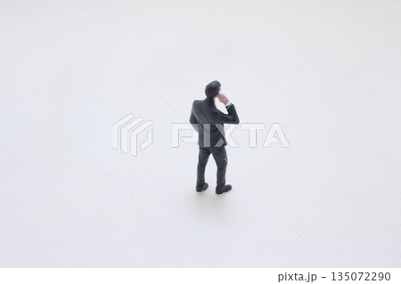 Men in dark suits forming professional security detail 135072290