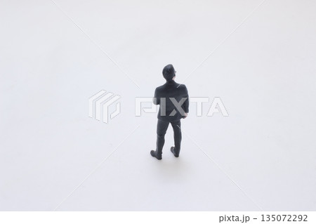 Men in dark suits forming professional security detail 135072292