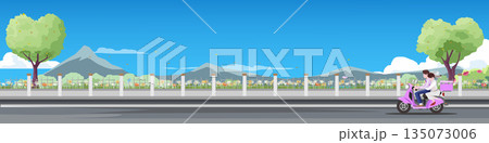 Happy newlywed couple riding a motorcycle on a road through a park. Bride and groom in wedding attire driving with mountain and blue sky background. Just married and honeymoon vector illustration. 135073006