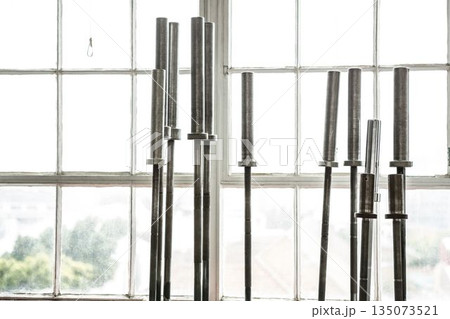 Barbells in exercise room Barbells in exercise room 135073521